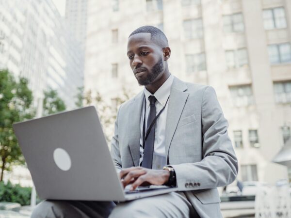 man doing remote work using a laptop